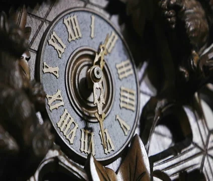 The hands of a cuckoo clock advance in this time lapse shot. Video stock 944402