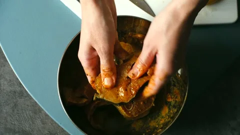Hands culinary enthusiast skillfully mixing fish in a bowfood preparation Video stock 317906669