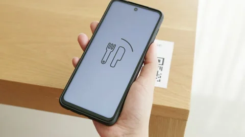 Hand's customer scan QR code for online menu service at table in restaurant Stock Footage 146264319