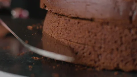Hands Cut Baked Brownie in the Kitchen. Stock Footage 168806399