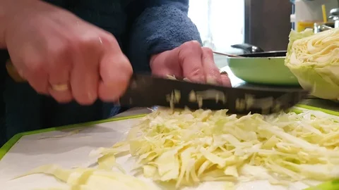 Hands cut cabbage in the kitchen Stock Footage 86307207