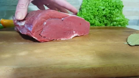 Hands cut raw meat Video stock 82953638