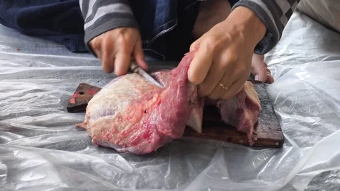 Hands cut raw meat on a wooden board Stock Footage 339428958