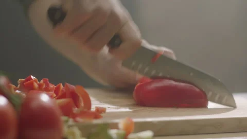 Hands cut sweet pepper in half and grind Stock Footage 198006196