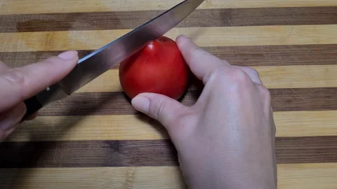 Hands cut tomatoes for salad Stock Footage 157396764