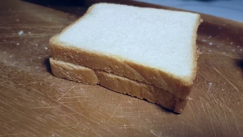 Hands cut white bread Stock Footage 83952495
