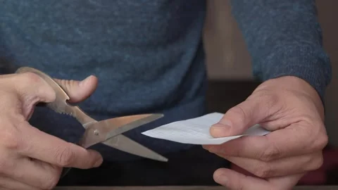 Hands cut white paper with scissors Vídeos de archivo 341366191