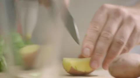 Hands cuts potatoes on the table Stock Footage 198701767
