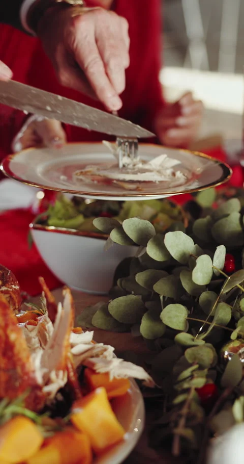 Hands, cutting and roast chicken in home with Christmas dinner, traditional meal Stock Footage 332898299