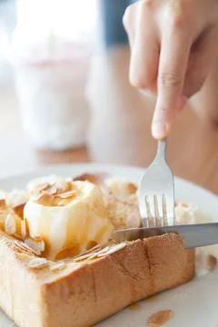 Hands cutting bread 스톡 사진