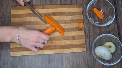 Hands Cutting Carrot Stock Footage 170451149