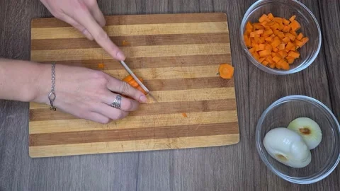 Hands Cutting Carrot Stock-Footage 170451328