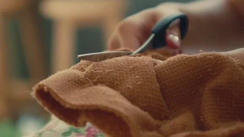 Hands Cutting Fabric For DIY Bear At Build-A-Bear Workshop - Close Up Stock Footage 298161811