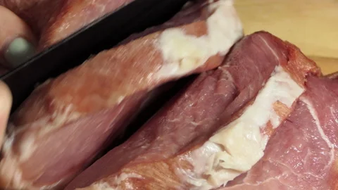 Hands cutting fresh meat 4 K Stock Footage 190527963
