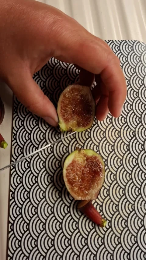 Hands Cutting Fresh Ripe Fig In Half Top View Vertical Form 스톡 동영상 342337432