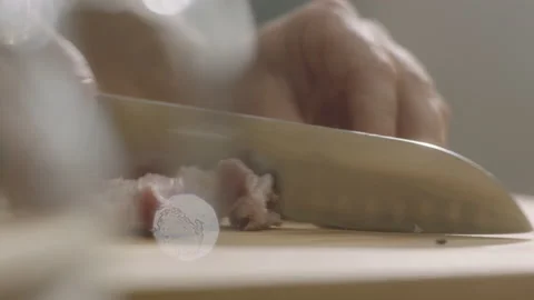 Hands cutting meat into small pieces Stock Footage 200937854