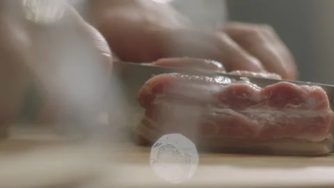 Hands cutting meat on the table Stock Footage 198702086