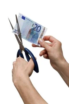 Hands cutting one banknote with scissors Stock Photos