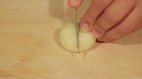The hands cutting onions on a board Stock Footage 68565949