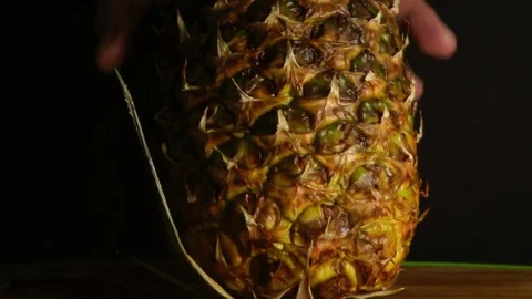 Hands Cutting pineapple on black background 库存影片 85287275