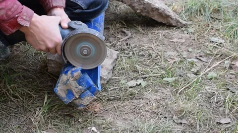 Hands cutting plastic pipe with angle grinder Video stock 68315601