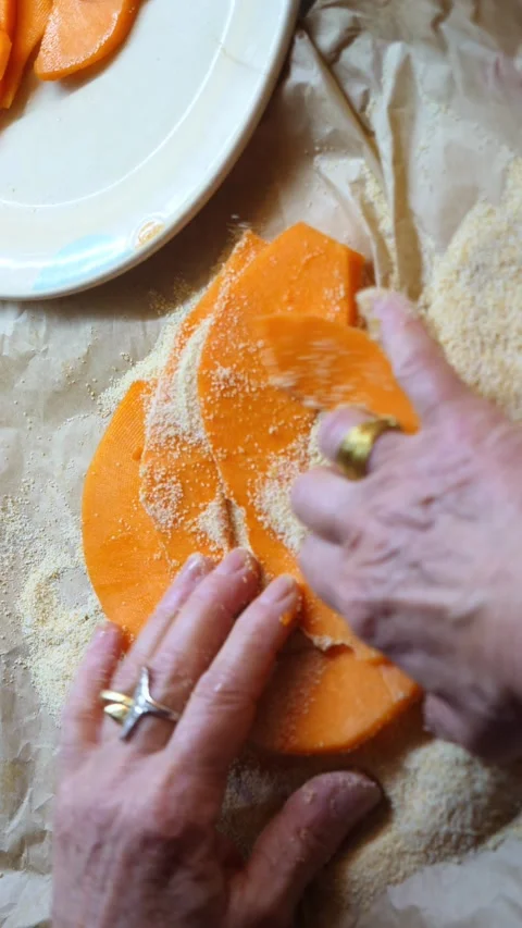 Hands cutting pumpkin into thin slices for Italian gratin Stock Footage 305857804