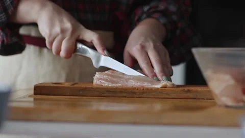 Hands cutting raw chicken Stock Footage 231794346