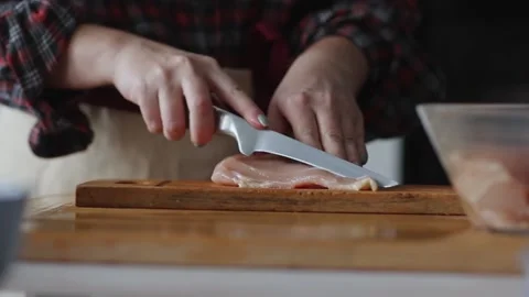 Hands cutting raw chicken Stock Footage 231794473