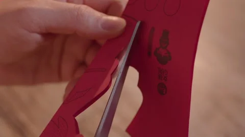 Hands Cutting Red Paper with Scissors for Craft Project Vídeos de archivo 336546942