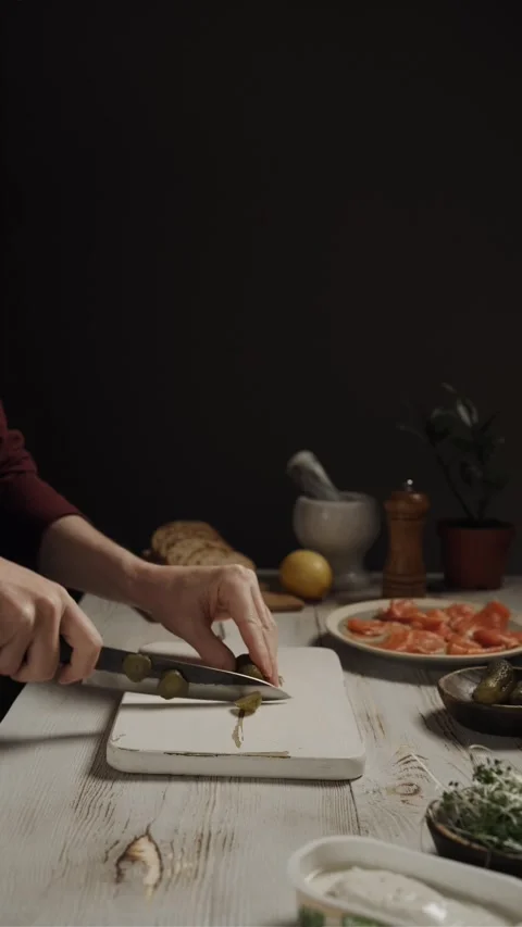 Hands cutting slices of pickled cucumber Stock Footage 292979857