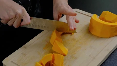 Hands Cutting Squash on Wooden Board Cooking Stock Footage 341445008
