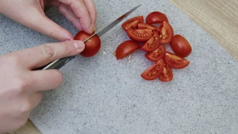 Hands cutting tomatoes. Stock Footage 266419632