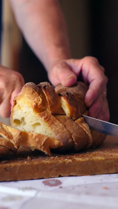 Hands cutting traditional Matera bread Stock Footage 284236803