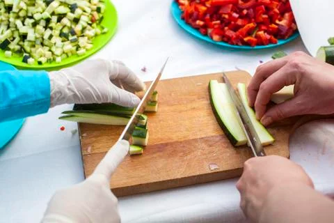 Hands cutting zucchini Stock Photos