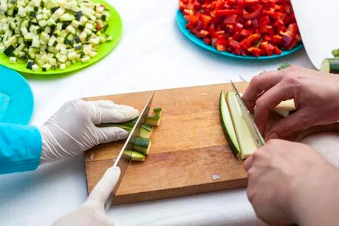 Hands cutting zucchini Stock Photos