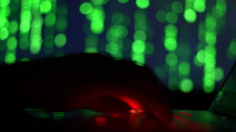 Hands of a cybercriminal working with a computer keyboard. Stock Footage 260841903