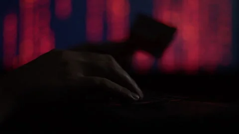 Hands of a cybercriminal working with a computer keyboard. Stock Footage 260842660