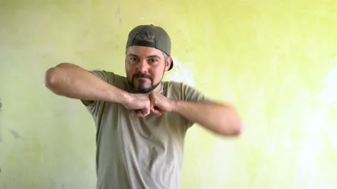 Hands dance men against the wall 4K Video stock 125283475