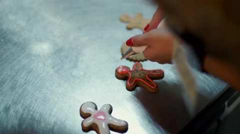 Hands Decorating christmas cookies with selective focus and place for text Stock Footage 57498304