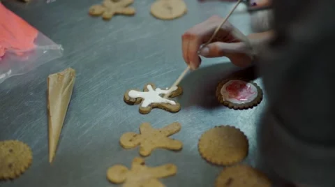 Hands Decorating christmas cookies with selective focus and place for text Stock Footage 57498681