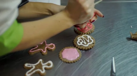 Hands Decorating christmas cookies with selective focus and place for text Stock Footage 57498795