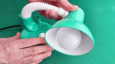 Hands Demonstrate Green Desk Lamp Device with Flexible Hose and Power Button Stock Footage 328698689