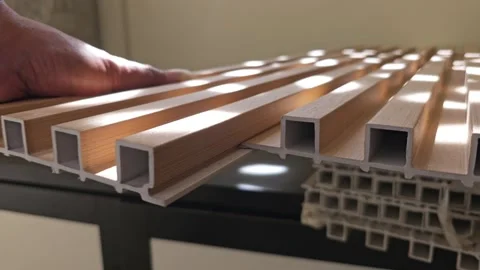 Hands Demonstrating Interlocking Mechanism Of Wooden Fluted Wall Panels Stock Footage 340001598