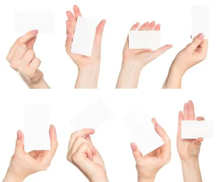 Hands demonstrating various positions holding blank cards in a minimalist setup Stock Photos