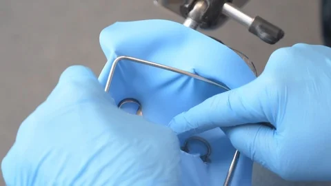 The hands of the dentistry teacher working the denture Video stock 118272980