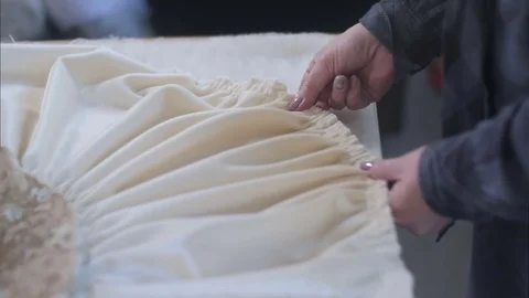 Hands of designer at work with fabric Video stock 81663304