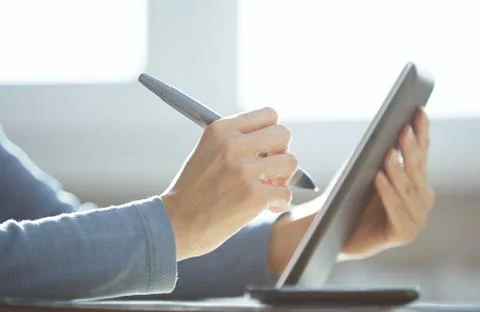 Hands of designer working with tablet PC and stylus Stock Photos