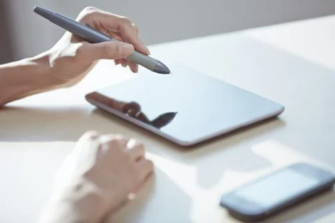 Hands of designer working with tablet PC and stylus Stock Photos