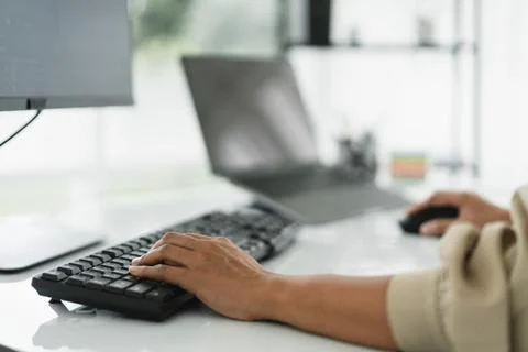 Hands of developer programmer using mouse and typing on keyboard to program.. Stock Photos