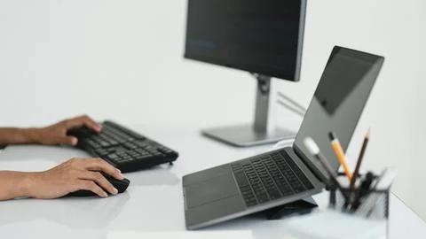 Hands of developer programmer using mouse and typing on keyboard to program.. Stock Photos